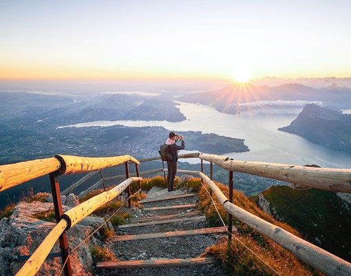Man photographing a sunrise on Mount Pilatus