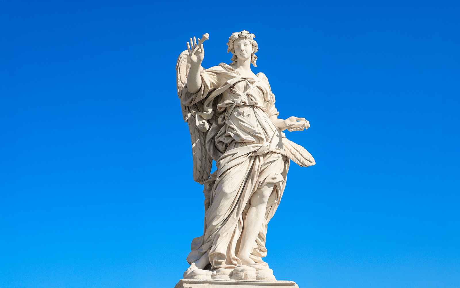 Angel with the Nails statue on Ponte Sant'Angelo Bridge, Rome, with Tiber River in the background.