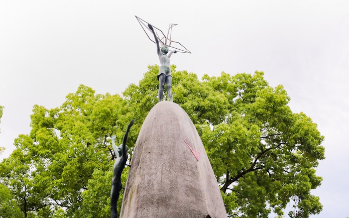 Children's Peace Monument with origami crane in Hiroshima's Peace Memorial Park.