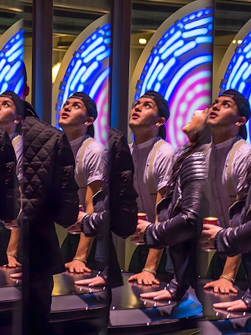 Visitors engaging with interactive exhibit at San Francisco Exploratorium.