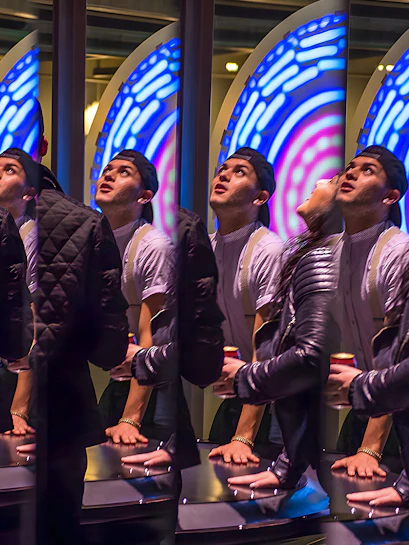 Visitors engaging with interactive exhibit at San Francisco Exploratorium.