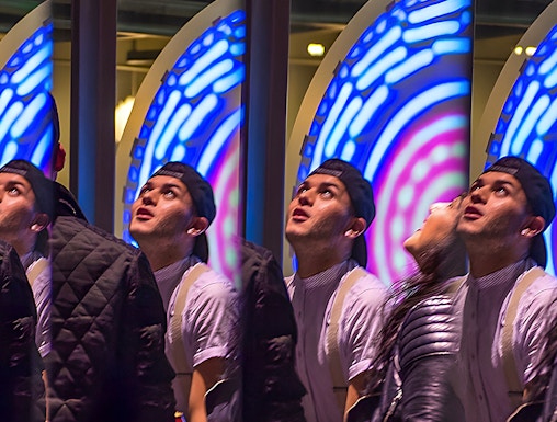 Visitors engaging with interactive exhibit at San Francisco Exploratorium.