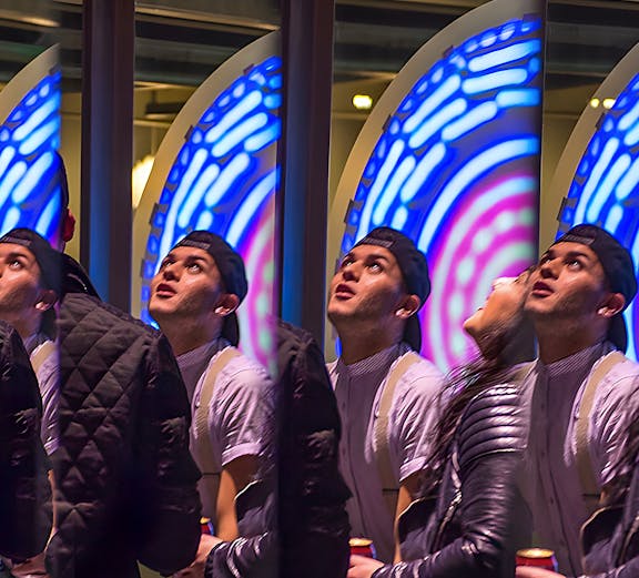 Visitors engaging with interactive exhibit at San Francisco Exploratorium.