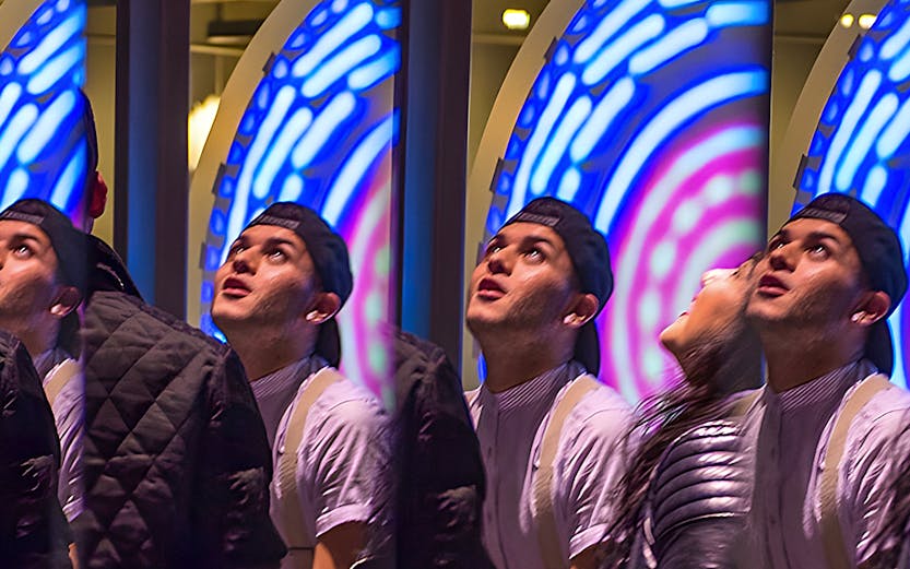 Visitors engaging with interactive exhibit at San Francisco Exploratorium.