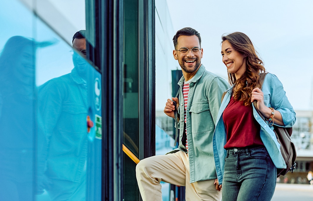 Passengers getting on a bus