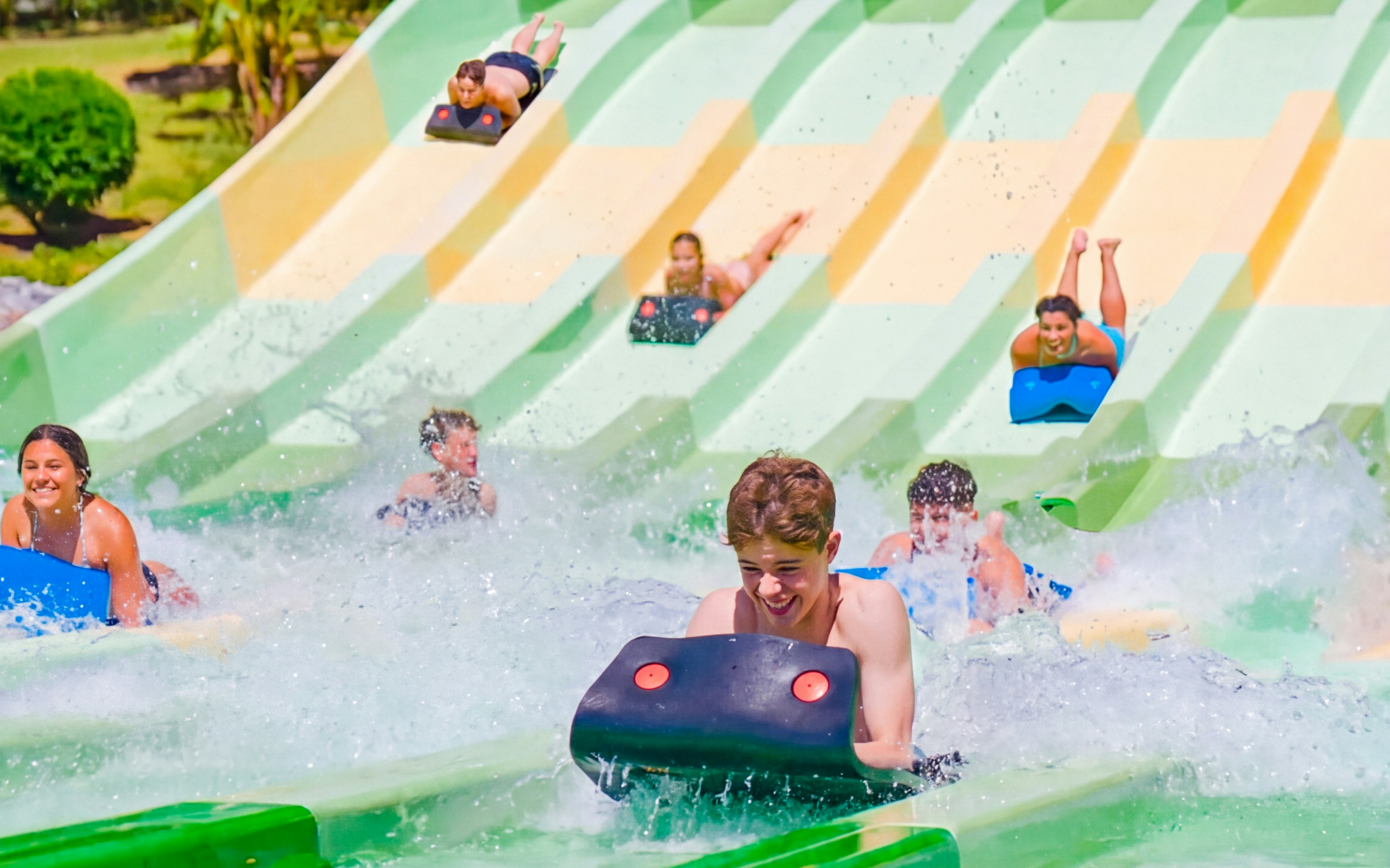 Visitors enjoying water slides at Aqualand Torremolinos, Spain.