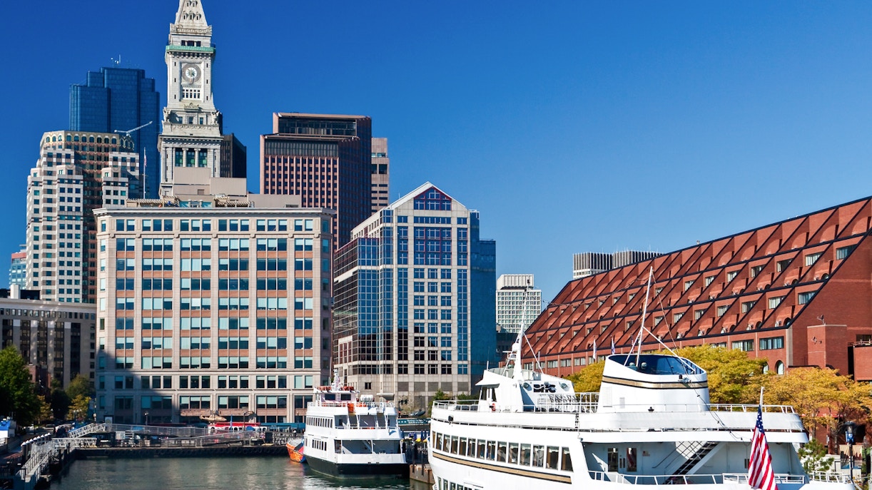 Cruise ships docked at Long Wharf with Boston skyline in the background.