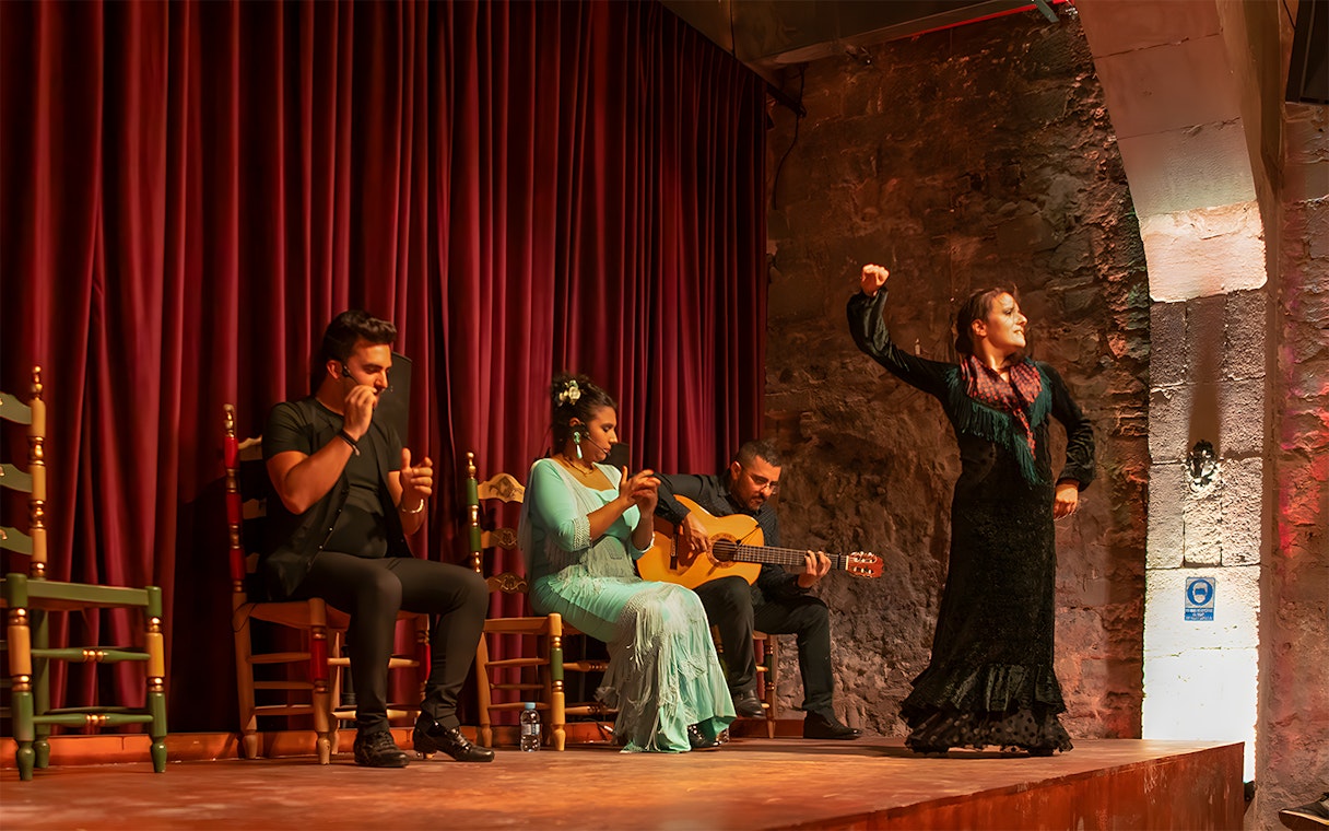 Flamenco performers on stage at Palau Dalmases, Barcelona.