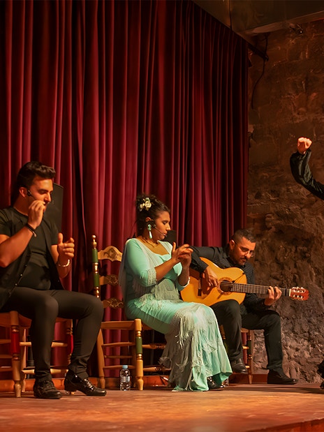 Flamenco performers on stage at Palau Dalmases, Barcelona.