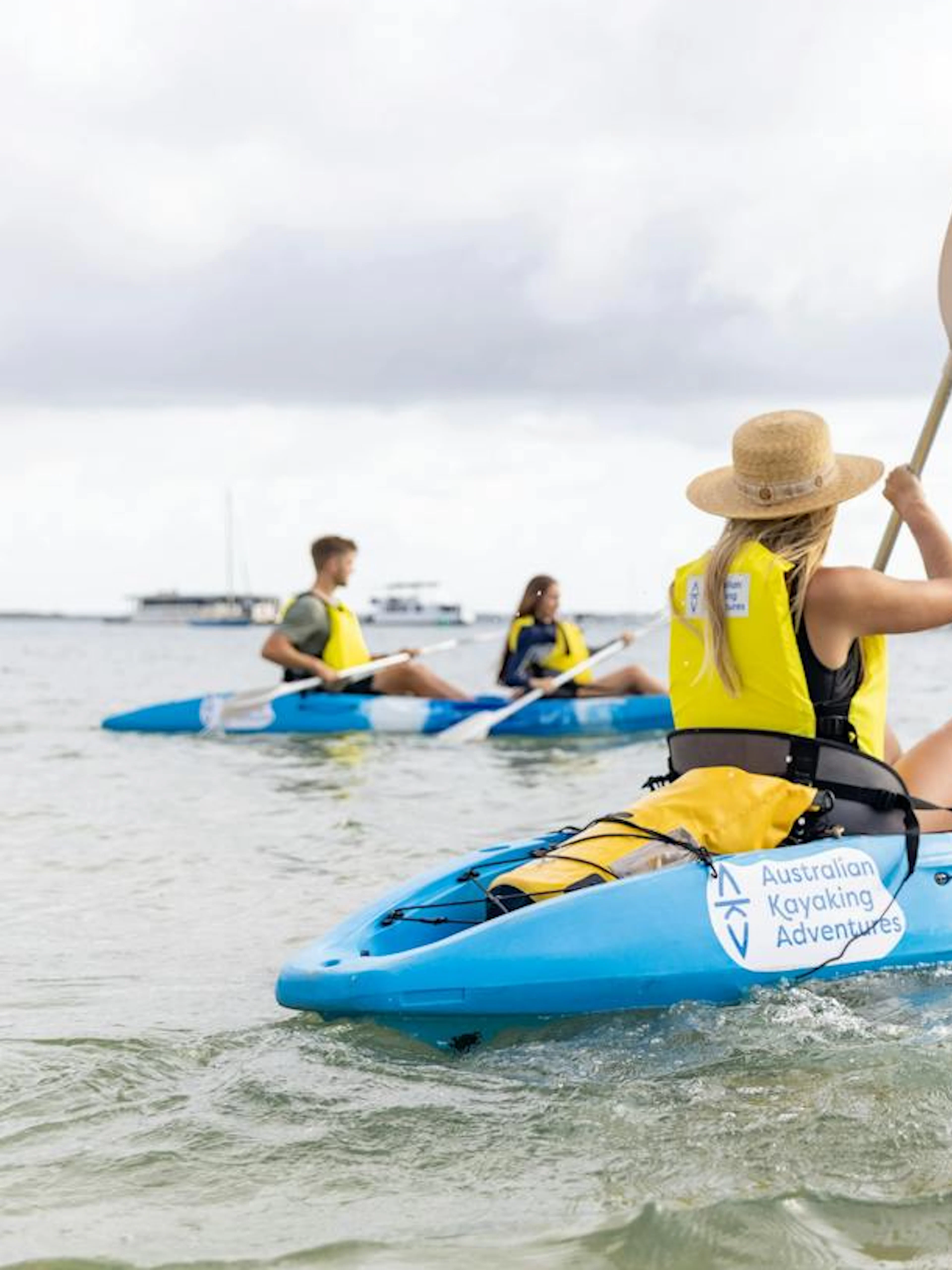 Kayakers paddling on a guided tour in Gold Coast waters.