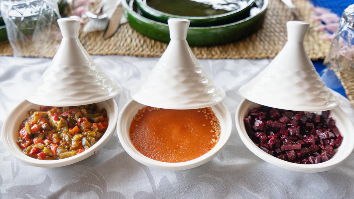 Traditional Moroccan tagines with vegetables and sauces, Morocco.