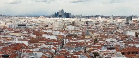 Panoramic view of Madrid city showcasing famous landmarks and vibrant street life, ideal for city tours and cultural exploration