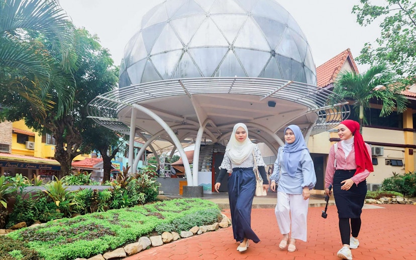 Women walking near SkyDome in Langkawi, Malaysia.