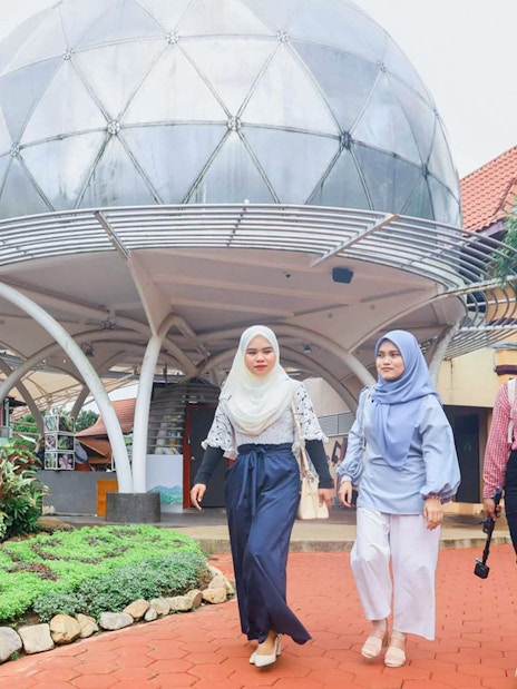 Women walking near SkyDome in Langkawi, Malaysia.