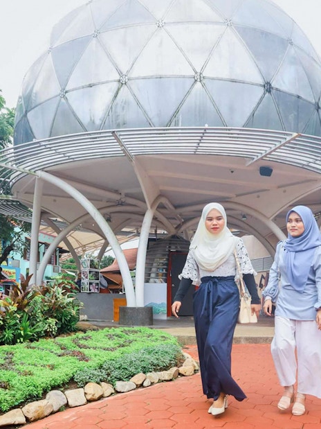 Women walking near SkyDome in Langkawi, Malaysia.