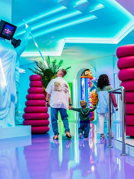 Visitors exploring vibrant House of Hype exhibit in Dubai.