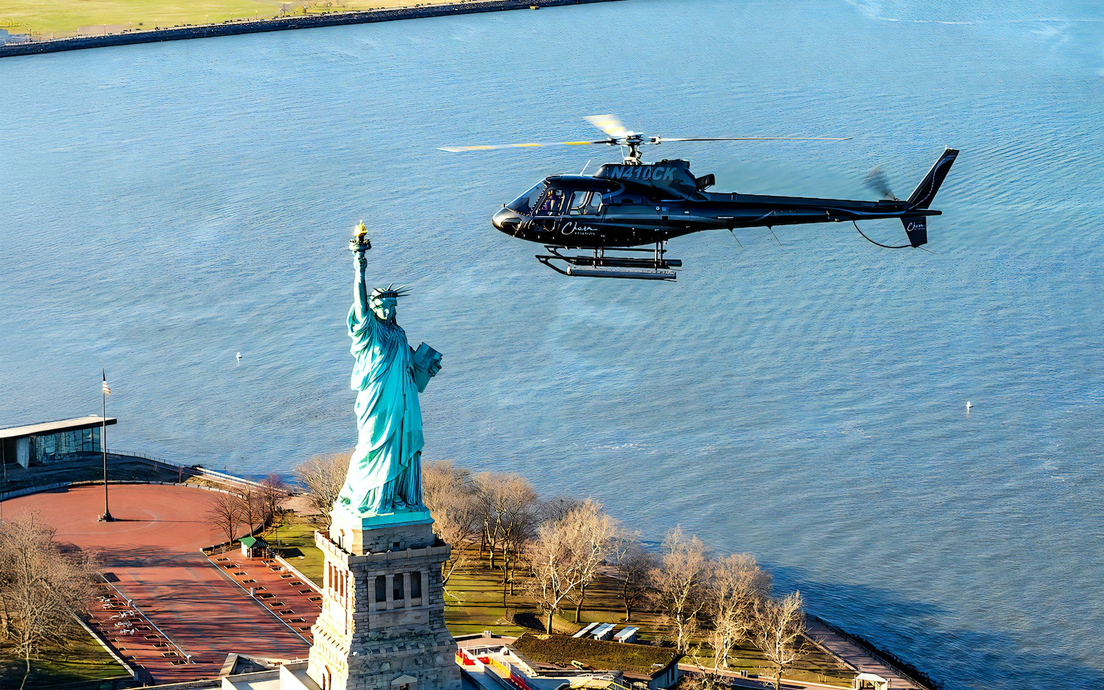 Helicopter flying near the Statue of Liberty during a 5-minute NYC tour.