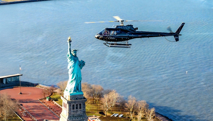 Helicopter flying near the Statue of Liberty during a 5-minute NYC tour.