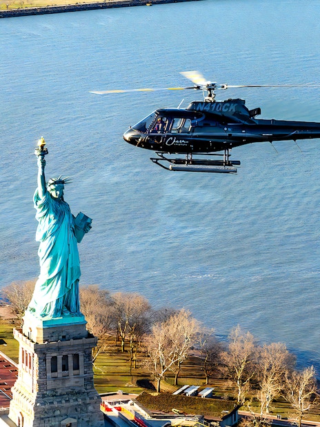 Helicopter flying near the Statue of Liberty during a 5-minute NYC tour.