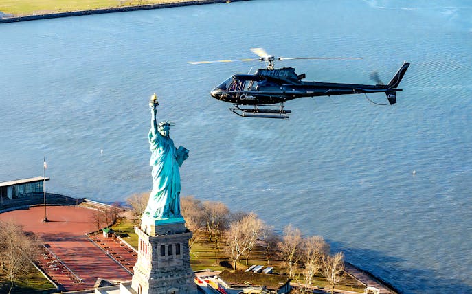 Helicopter flying near the Statue of Liberty during a 5-minute NYC tour.