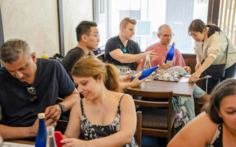 Tourists tasting sake at Kyoto Insider Sake Experience.