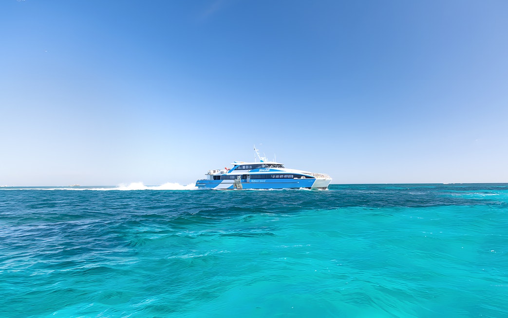 Ferry traveling across turquoise waters to Rottnest Island from Perth or Fremantle.