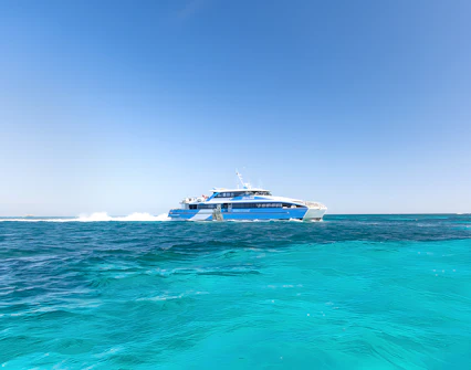 Ferry traveling across turquoise waters to Rottnest Island from Perth or Fremantle.