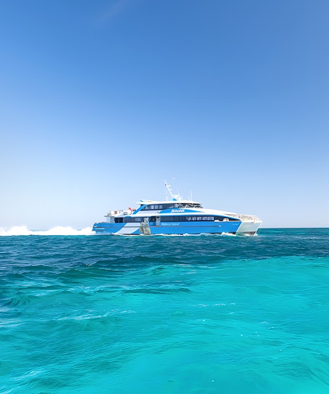 Ferry traveling across turquoise waters to Rottnest Island from Perth or Fremantle.
