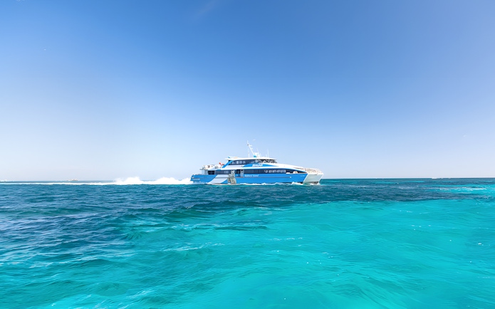Ferry traveling across turquoise waters to Rottnest Island from Perth or Fremantle.