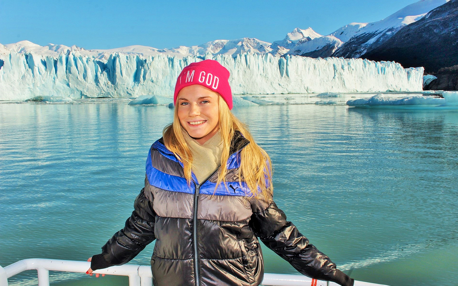 Tourist enjoying Perito Moreno Glacier view from cruise in Argentina.