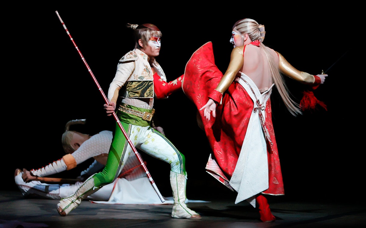 Performers in dynamic action scene from Cirque du Soleil KÀ show.