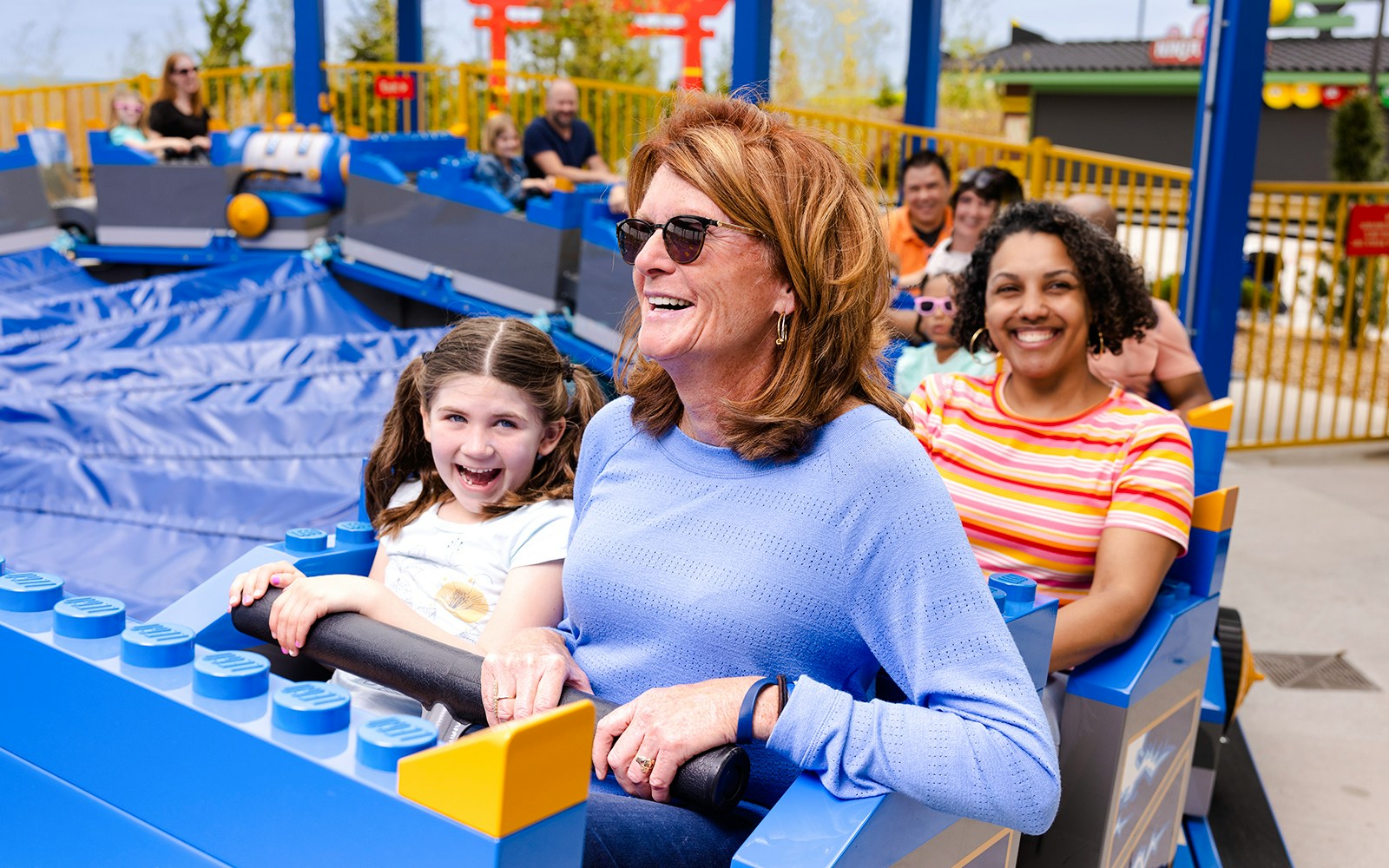 Guests enjoying a ride at Legoland, New York.
