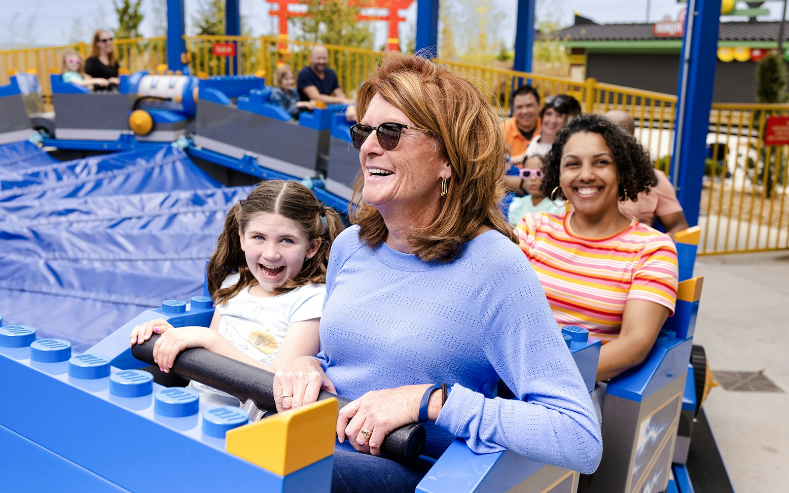 Guests enjoying a ride at Legoland, New York.