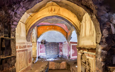 Catacombs passage with frescoes, Rome guided tour.