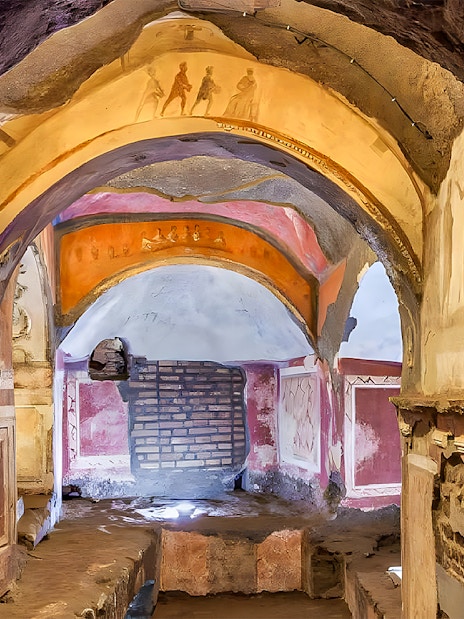 Catacombs passage with frescoes, Rome guided tour.