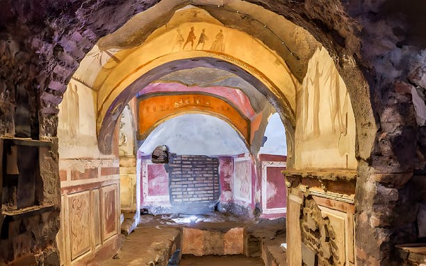 Catacombs passage with frescoes, Rome guided tour.