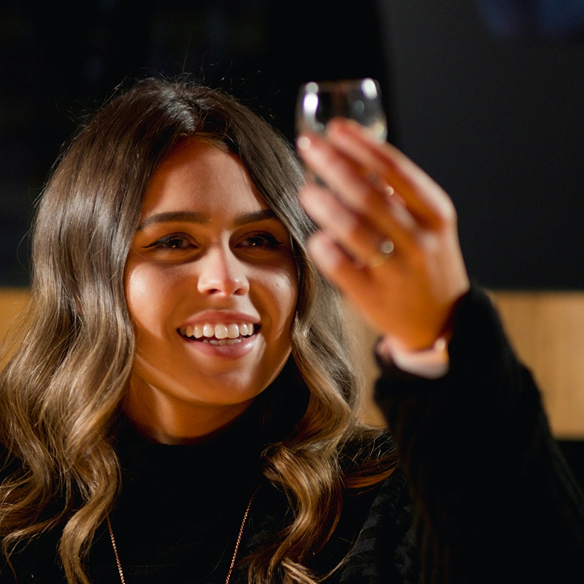 Woman tasting whiskey at Jameson Distillery tour in Dublin.