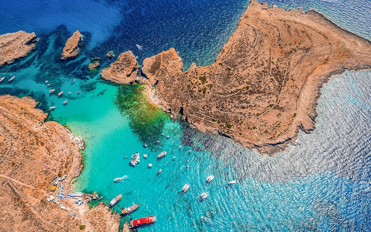 Aerial view of boats near Comino's Blue Lagoon, Malta, on a Turkish Gulet cruise from Sliema.