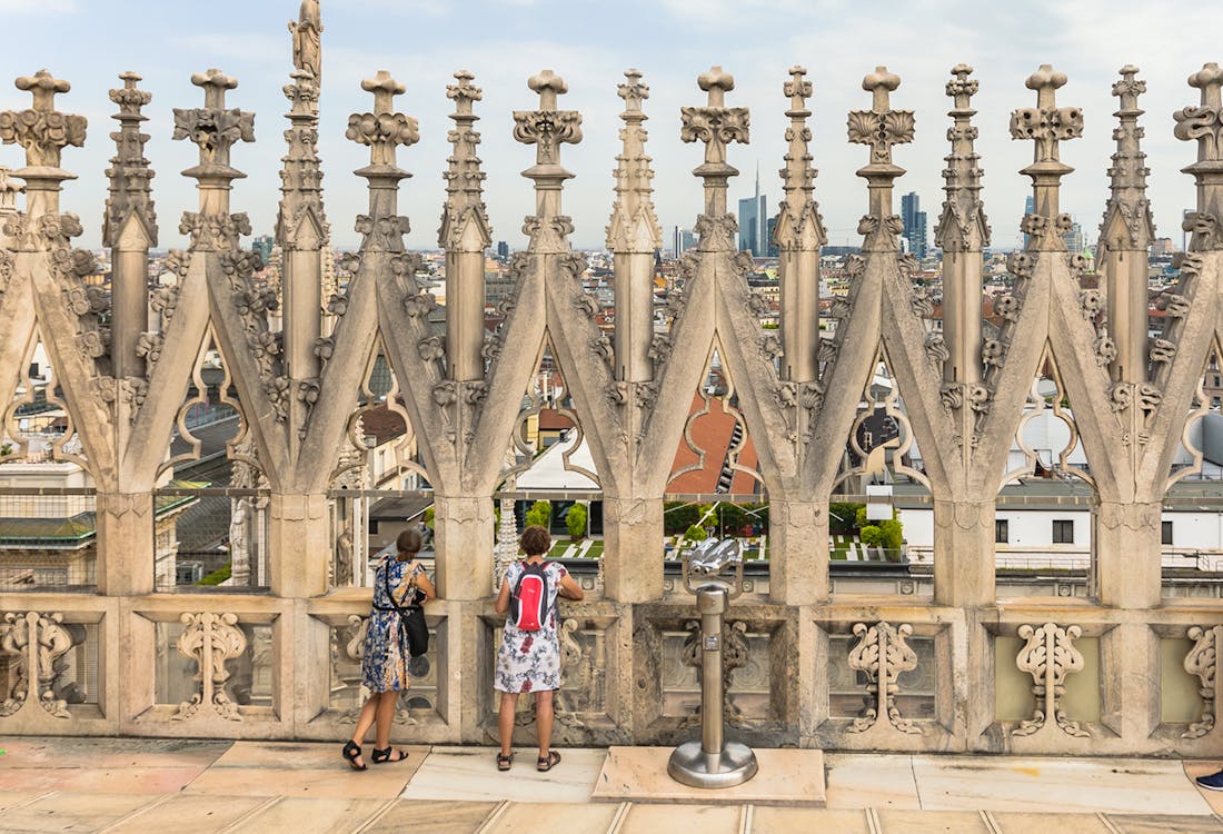 Visitor exploring Duomo Milan's rooftop.