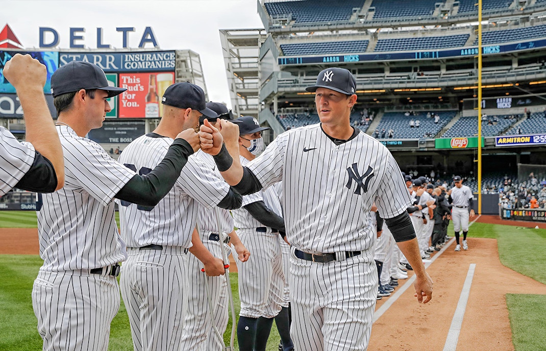 New York Yankees players greeting each other before the game against Washington Nationals at Yankee Stadium.