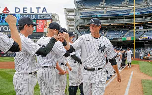 New York Yankees players greeting each other before the game against Washington Nationals at Yankee Stadium.