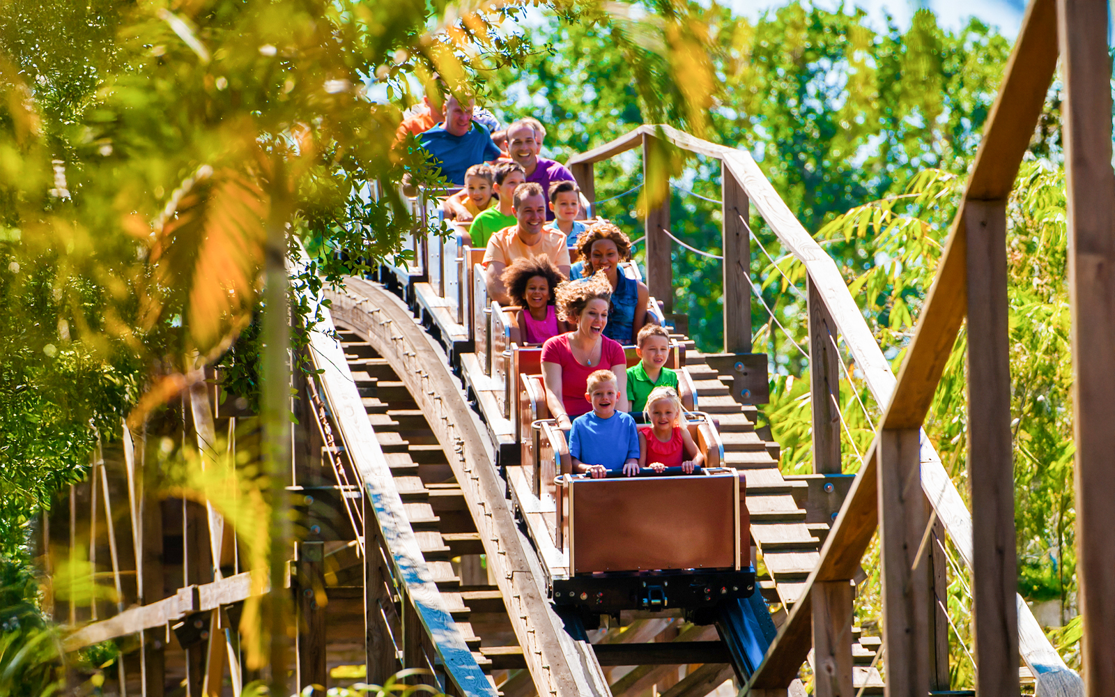Visitors enjoying the Coastersaurus ride at LEGOLAND Theme Park, Florida.
