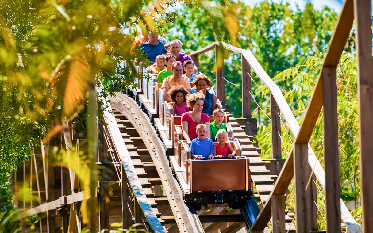 Visitors enjoying the Coastersaurus ride at LEGOLAND Theme Park, Florida.