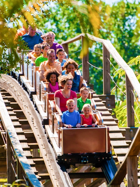 Visitors enjoying the Coastersaurus ride at LEGOLAND Theme Park, Florida.