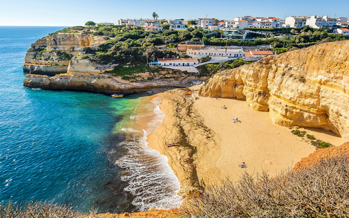 Benagil Caves beach with cliffs and ocean, Portugal, part of Dolphin Discovery tour.