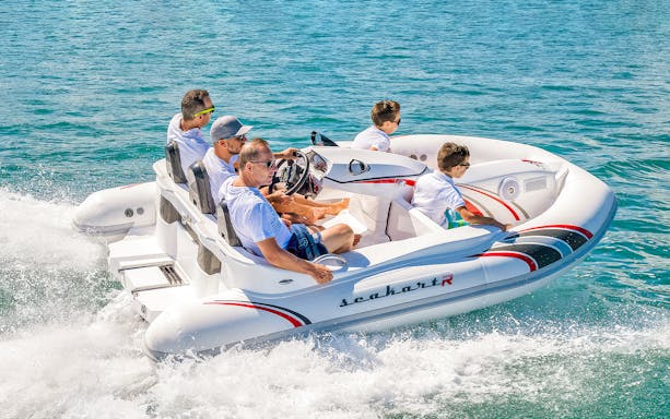 Group enjoying a self-drive boat tour on Dubai waters.