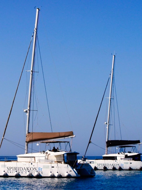 Catamarans on the water during a Classic Catamaran Cruise in Santorini.