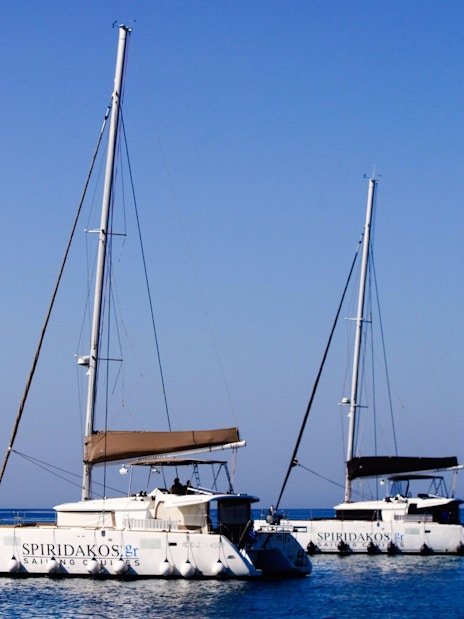 Catamarans on the water during a Classic Catamaran Cruise in Santorini.