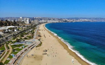 Aerial view of Acapulco Beach, Viña del Mar, Chile, with cityscape and coastline.