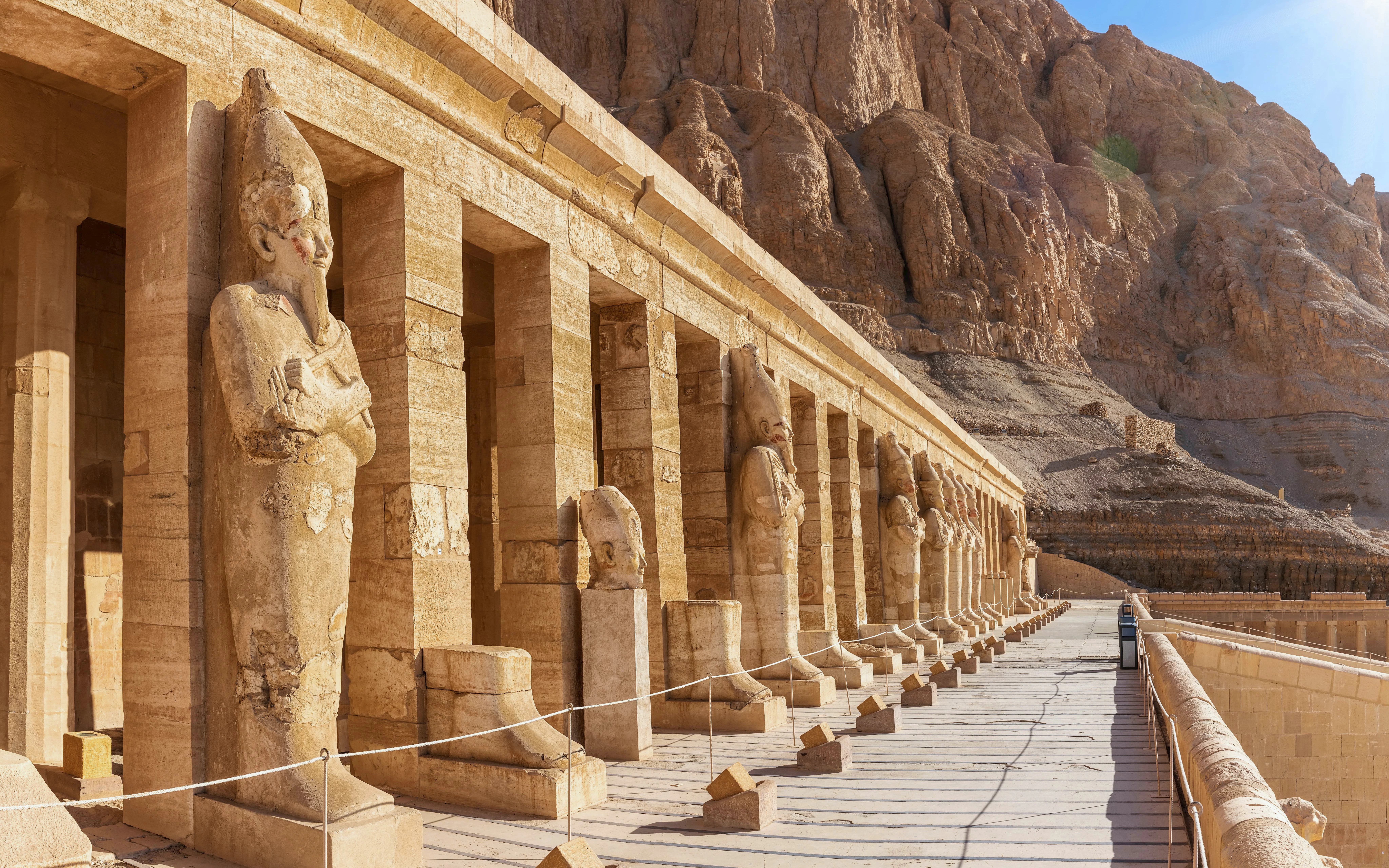Osiride statues line the façade of the Mortuary Temple of Hatshepsut, Luxor, Egypt.